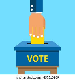 Hand putting voting paper in the ballot box