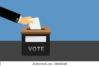  hand putting voting paper in the ballot box
