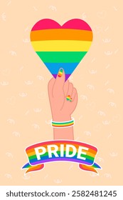 Hand with rainbow bracelet and nail polish holding a heart with rainbow colors celebrating pride and lgbtq+ community