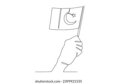 Una mano levantó la pequeña bandera pakistaní. Dibujo de una línea en el Día de Pakistán