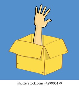 A hand reaches out of a cardboard box as if someone is trapped inside. A metaphor for escape or thinking outside th box