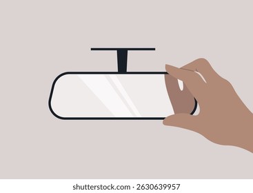 A hand reaches toward a rear view mirror, positioning it for optimum reflection, It captures the intention to ensure safety and awareness on the road ahead