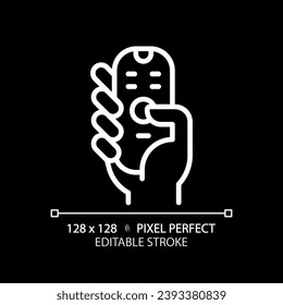 Hand with remote control pixel perfect white linear icon for dark theme. Digital device with keys. Contactless infrared gadget. Thin line illustration. Isolated symbol for night mode. Editable stroke