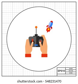 Hand with remote control starting rocket