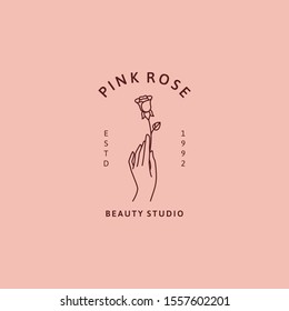 Hand and rose logo in minimal trendy linear style. Vector icon for beauty Studio Pink rose. Concept for cosmetics, nail salon, floral shop, hand made, jewelry, tattoo master