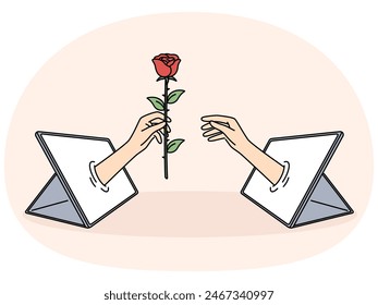 Mano con rosa en la tableta es una metáfora para las relaciones en línea y las citas con dispositivos digitales. Coqueteo en línea y envío de regalos virtuales a través de App de redes sociales para el concepto de relaciones a distancia