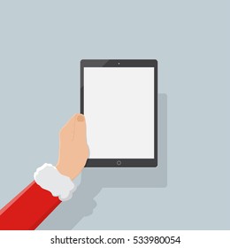 hand of santa holding tablet,christmas background,flat design