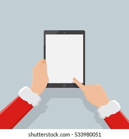 hand of santa holding tablet,christmas background,flatdesign