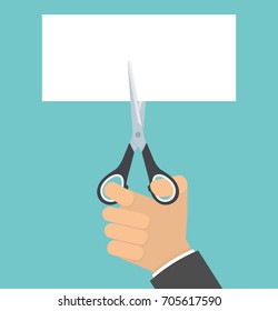 Hand with scissors cutting blank paper