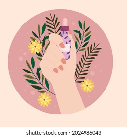 hand with serum dropper and flowers