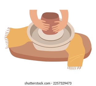 Conformación manual de una olla sobre la rueda de la cerámica durante el concepto del taller.