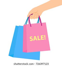 In the hand shopping bags with the sale. Vector illustration on white background.