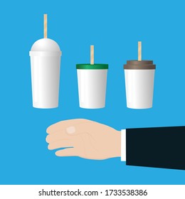 Hand show holding something like a bottle. Paper coffee cups and plastic transparent disposable cup