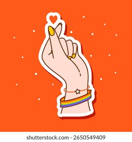 Mão mostrando sinal de coração com pulseira de cor bandeira LGBTQ no fundo vermelho - ilustração vetorial para adesivo feliz orgulho mês