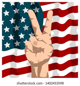 Hand shows victory gesture on background american flag