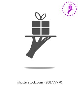 hand silhouette presenting beautiful gift pack concep