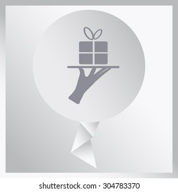 hand silhouette presenting beautiful gift pack concep