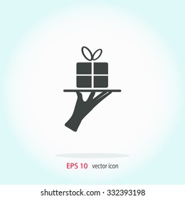 Hand silhouette presenting beautiful gift pack concep