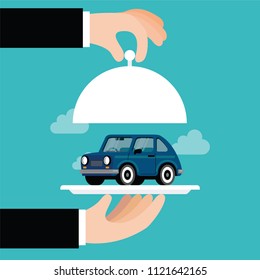 Hand with silver tray with a car on it