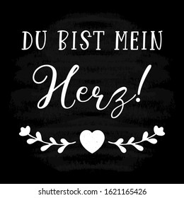 Hand sketched „Du bist mein Herz“ German quote, meaning „You are my heart“. Romantic calligraphy phrase. Lettering for design, print, poster, clothes, card, invitation, banner template typography. 