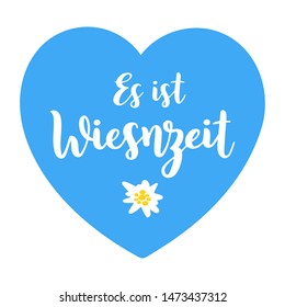 Hand sketched Es ist Wiesnzeit quote in German on a blue heart and edelweiss flower. Meaning It´s Oktoberfest time. Isolated on white background. Drawn Wiesn lettering typography, vector illustration