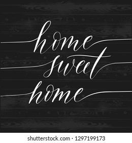 Hand sketched home Sweet home - typography lettering poster. Modern calligraphy. Isolated on black wood background. Vector illustration.