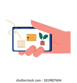 Hand with smartphome ordering home goods and paying online with card