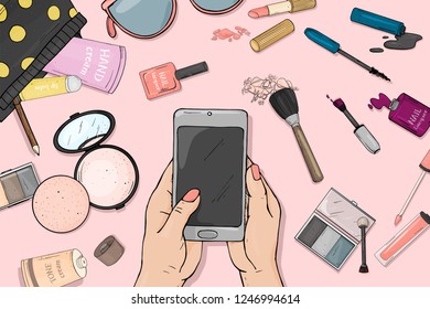 Hand with a smartphone and colorful items of women's cosmetics. Decorative cosmetics for face and nails. For beauty, fashion magazine, print media, web apps, mobile apps.