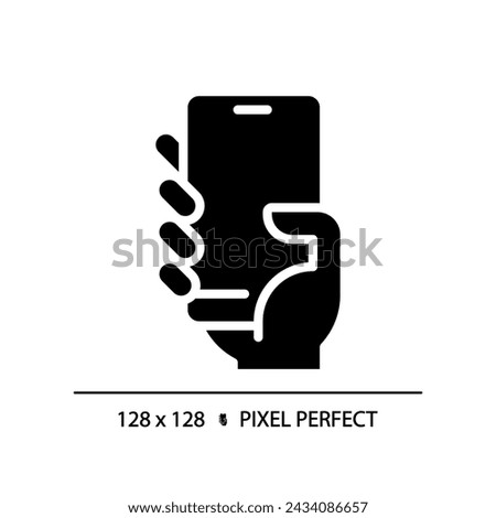 Hand with smartphone pixel perfect black glyph icon. Person holding cell phone. Mobile device for communication. Silhouette symbol on white space. Solid pictogram. Vector isolated illustration