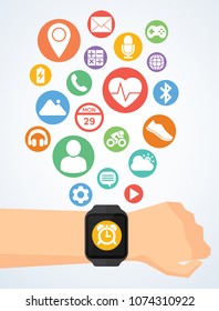 Hand with smartwatch and application icons on smartwatch