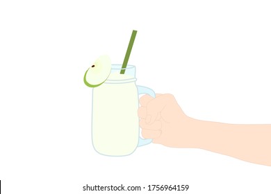 Hand is holding​ a smoothie juice in a glass cup with and has green apple slice on top. A cold soft drink for summer. Healthy beverage. Tasty and yummy food. A takeaway Product logo or advertisement.