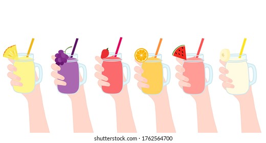 Hand is holding​ the smoothies juice in a glass cup with and has fruit on top. A cold soft drink for summer. Healthy beverage. A takeaway Product advertisement.