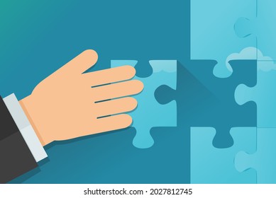 A hand solves a puzzle by putting a piece in the right place (flat design)