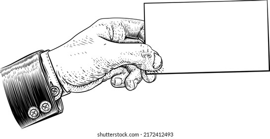 A hand in a suit holding a business card, letter, message, flyer or similar with copyspace. In a vintage engraved or etched woodcut print style