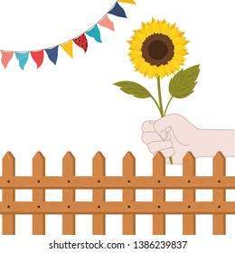 hand with sunflower isolated icon