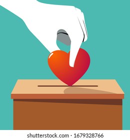 Hand throw heart into a box for donations