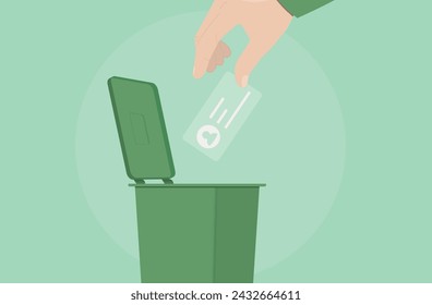 hand throwing object into trash can