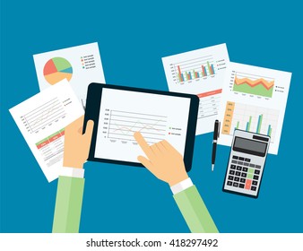  hand touch on analytic graph in device with report  planning paper concept   and business investment concept.