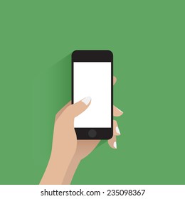 Hand touching blank screen of black smartphone. Green background.