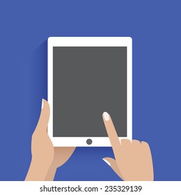 Hand touching blank screen of tablet computer.
