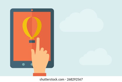 A hand is touching the screen of a tablet with air balloon icon. A contemporary style with pastel palette, light blue cloudy sky background. Vector flat design illustration. Horizontal layout with