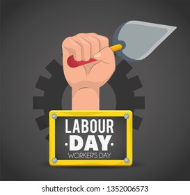 hand with trowel and emblem to labour day