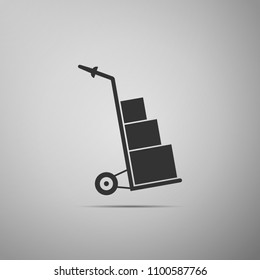 Hand truck and boxes icon isolated on grey background. Dolly symbol. Flat design. Vector Illustration