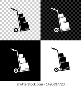 Hand truck and boxes icon isolated on black, white and transparent background. Dolly symbol. Vector Illustration