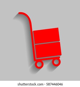 Hand truck sign. Vector. Red icon with soft shadow on gray background.