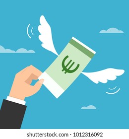 Hand trying to catch flying euro money.