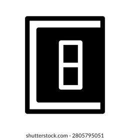 A hand turns a light switch on the wall for electricity and energy control.