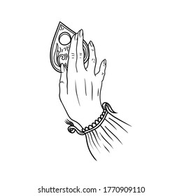 Una mano bajo la junta Ouija.