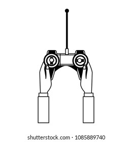 Hand using drone remote control on black and white
