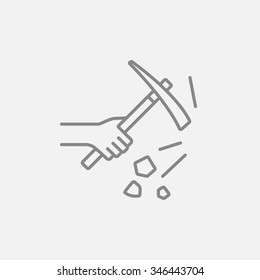 Hand using pickax line icon for web, mobile and infographics. Vector dark grey icon isolated on light grey background.